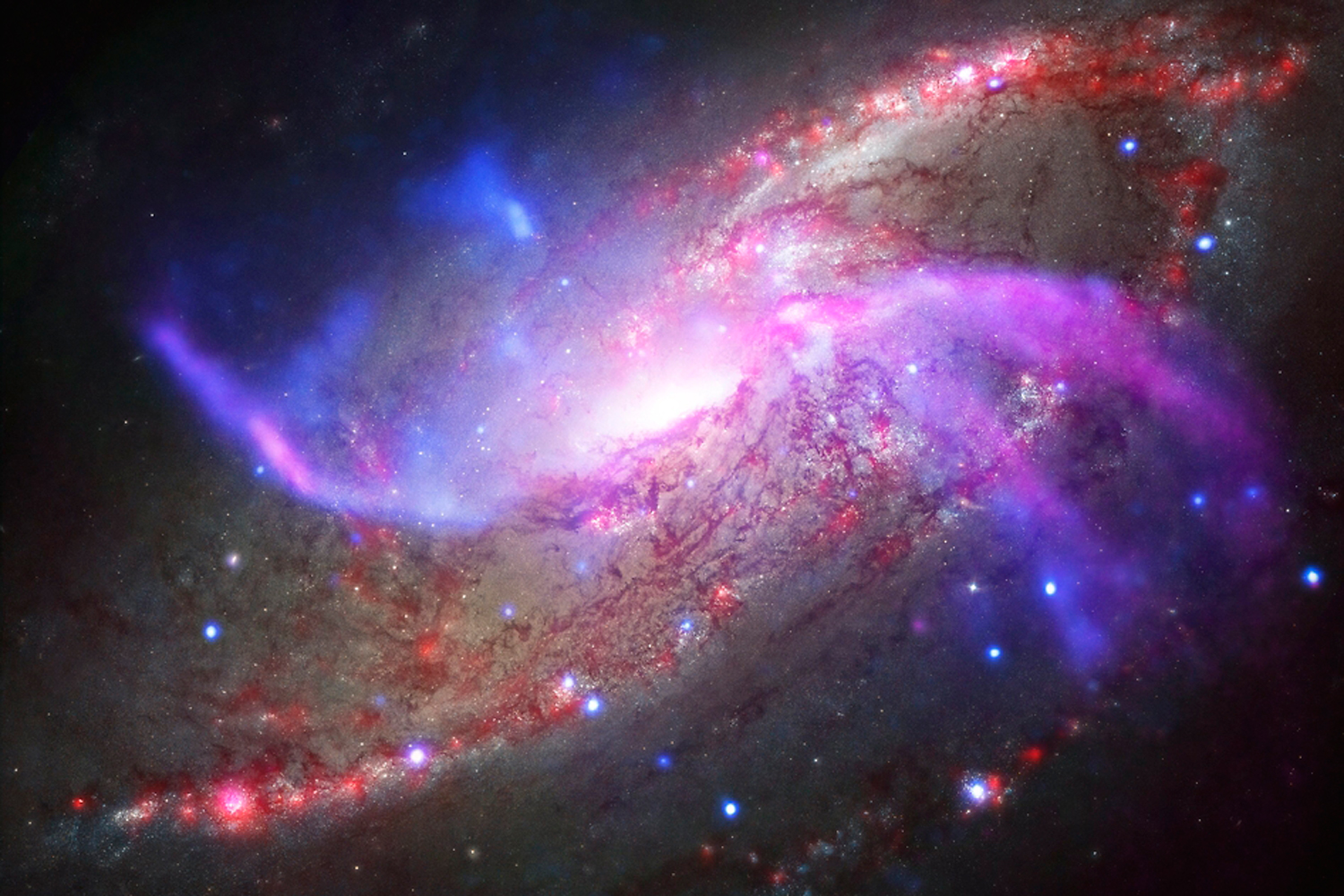 La galaxia Messier 106 expulsa gases de su agujero negro responsables de la formación de estrellas