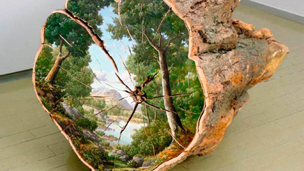 Artist paints the natural origins of trees on fallen logs.