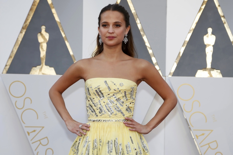Alicia Vikander, nominated for Best Supporting Actress in "Danish Girl," wears a yellow Louis Vuitton gown as she arrives at the 88th Academy Awards in Hollywood, California February 28, 2016.  REUTERS/Lucy Nicholson