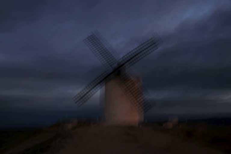 A windmill is seen at sunset in Consuegra, Spain, April 5, 2016. REUTERS/Susana Vera - RTX2AMMM