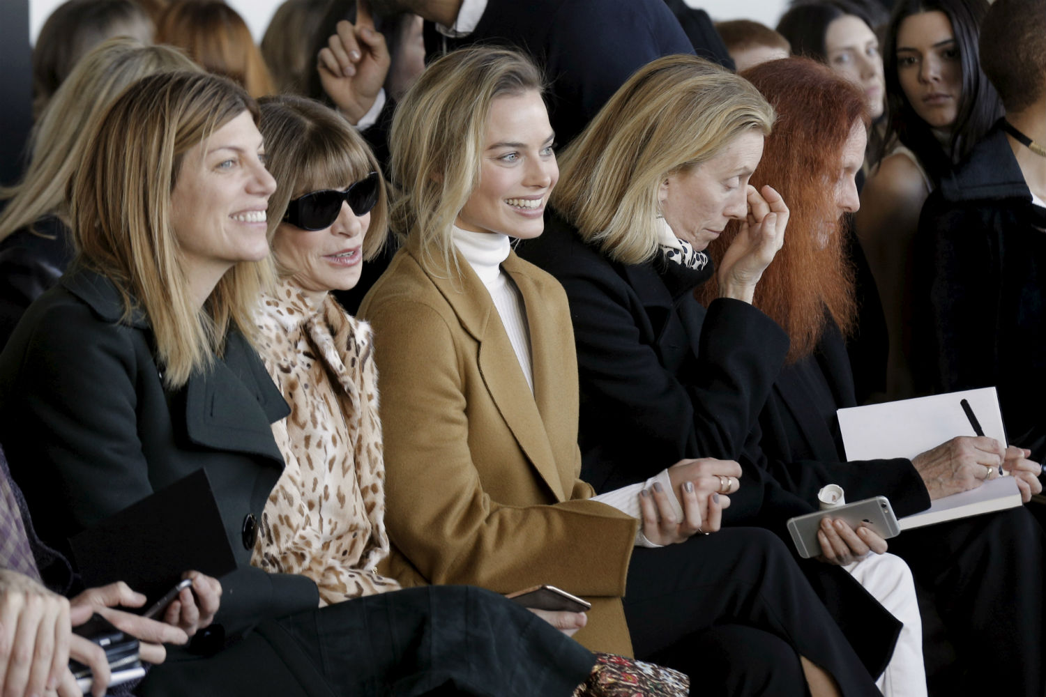 Vogue's Fashion Market/Accessories Director Virginia Smith, editor-in-chief Anna Wintour and actress Margot Robbie (L to R) attend the Calvin Klein Fall/Winter 2016 collection during New York Fashion Week in New York, February 18, 2016. REUTERS/Brendan McDermid