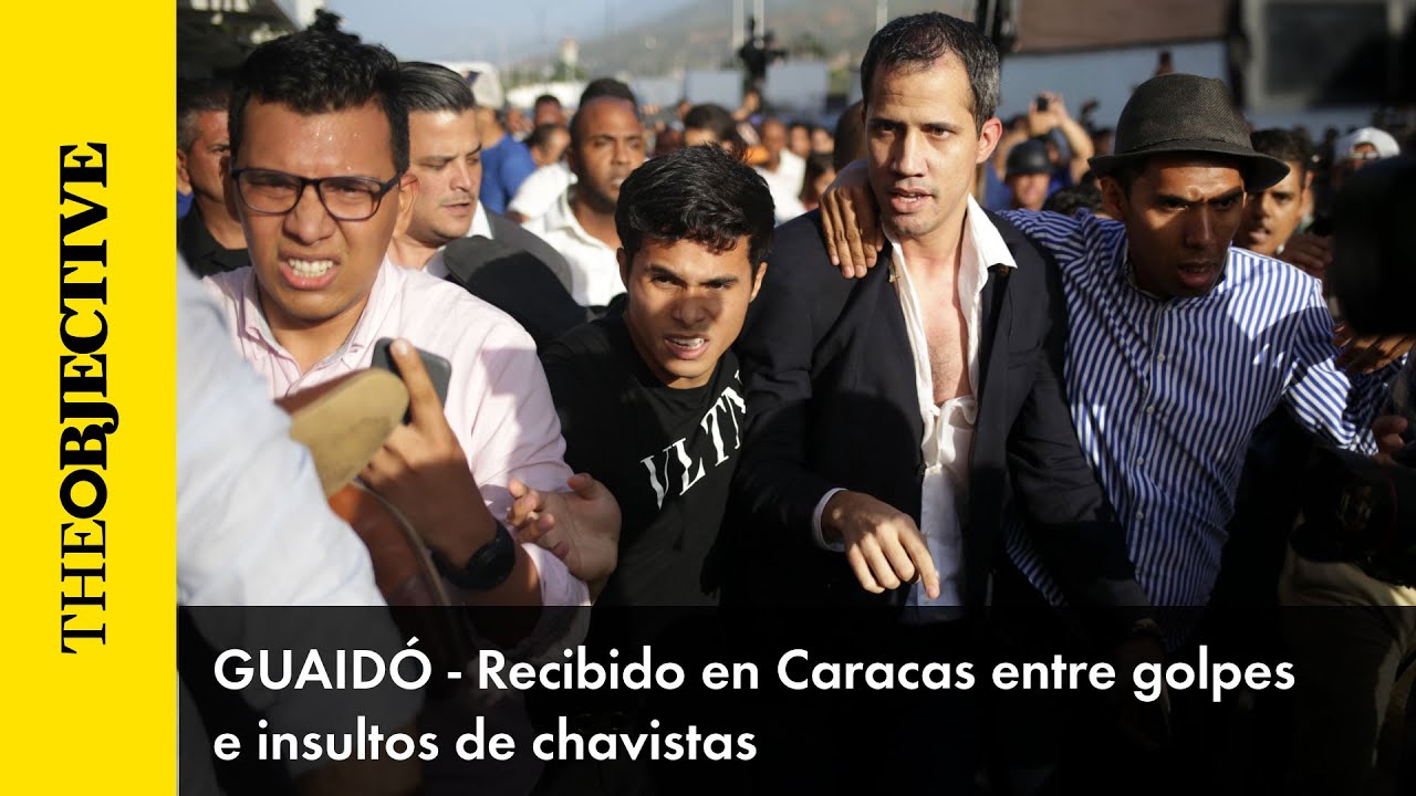 Guaidó llega a Caracas entre golpes e insultos de chavistas