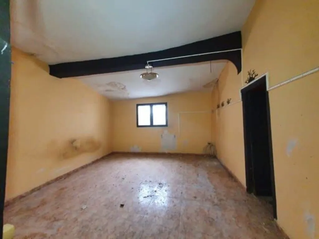 Una de las habitaciones de la casa. Building Center