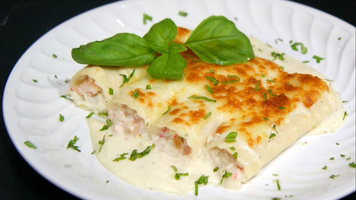 Canelones de puerro rellenos de langostinos y salmón ahumado con un toque gratinado